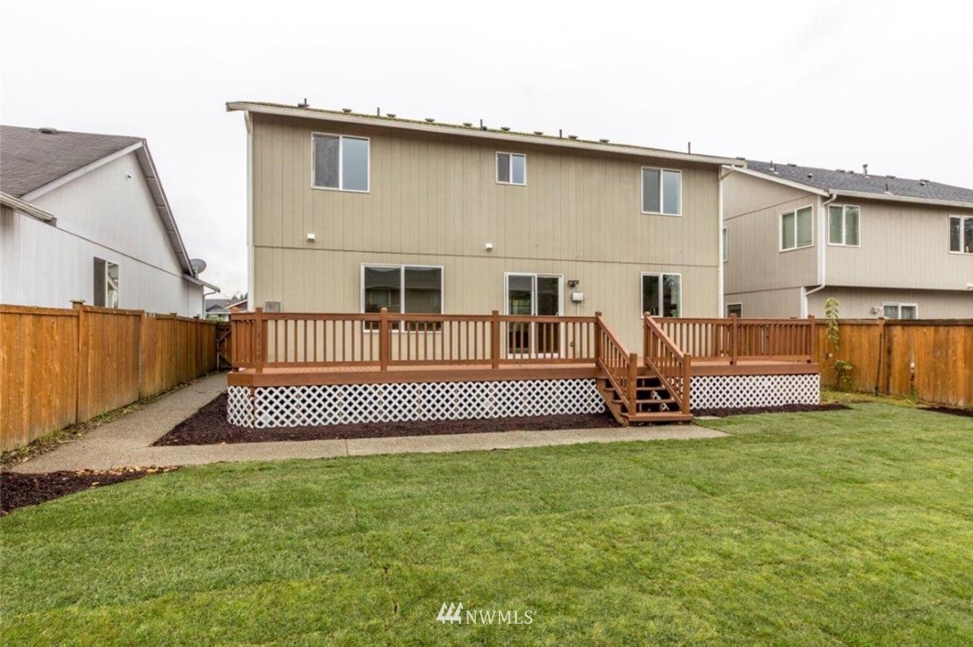 8341 49th Loop Southeast Olympia, WA 98513 - Photo 2 of 25 a view of a house with a patio and a yard