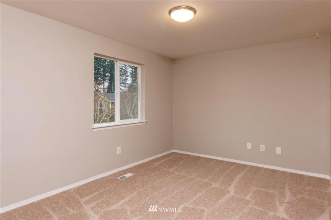8341 49th Loop Southeast Olympia, WA 98513 - Photo 16 of 25 an empty room with a window