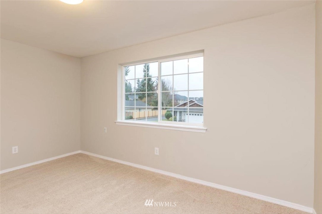 8341 49th Loop Southeast Olympia, WA 98513 - Photo 17 of 25 an empty room with a window