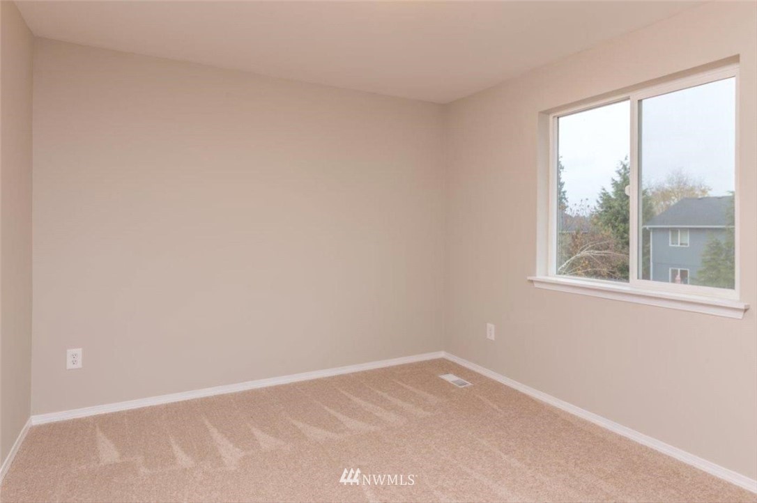 8341 49th Loop Southeast Olympia, WA 98513 - Photo 20 of 25 an empty room with a window
