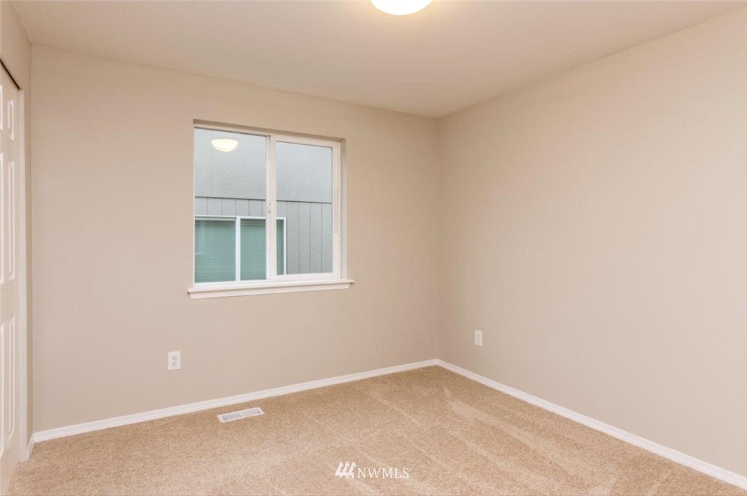 8341 49th Loop Southeast Olympia, WA 98513 - Photo 23 of 25 an empty room with a window