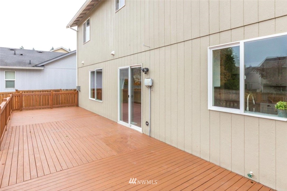 8341 49th Loop Southeast Olympia, WA 98513 - Photo 24 of 25 a view of a house with a backyard