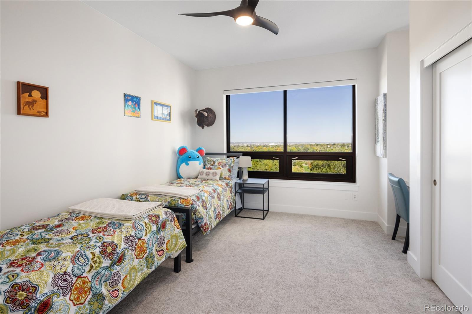 1650 Fillmore Street, Unit 1107 Denver, CO 80206 - Photo 21 of 49 a bedroom with a bed and a window