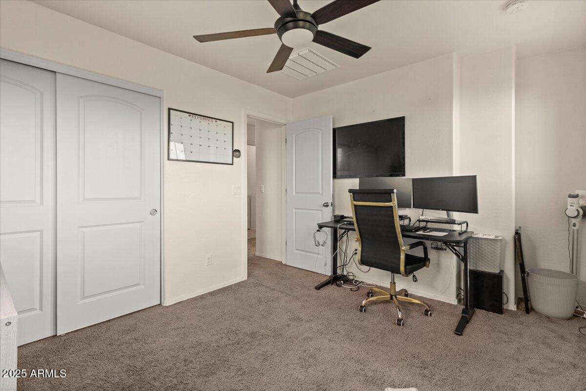 11452 West St John Road Surprise, AZ 85378 - Photo 16 of 29 a view of a workspace with furniture and a window