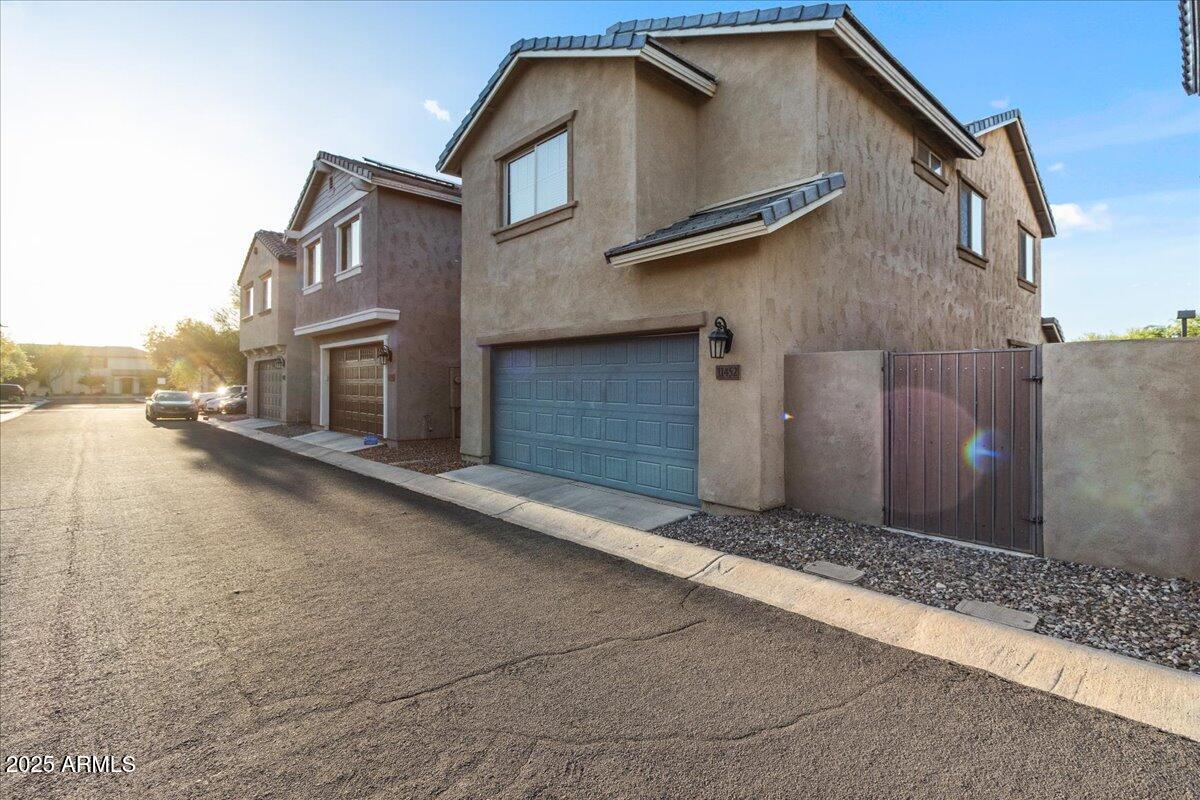 11452 West St John Road Surprise, AZ 85378 - Photo 24 of 29 a front view of a house with a garage
