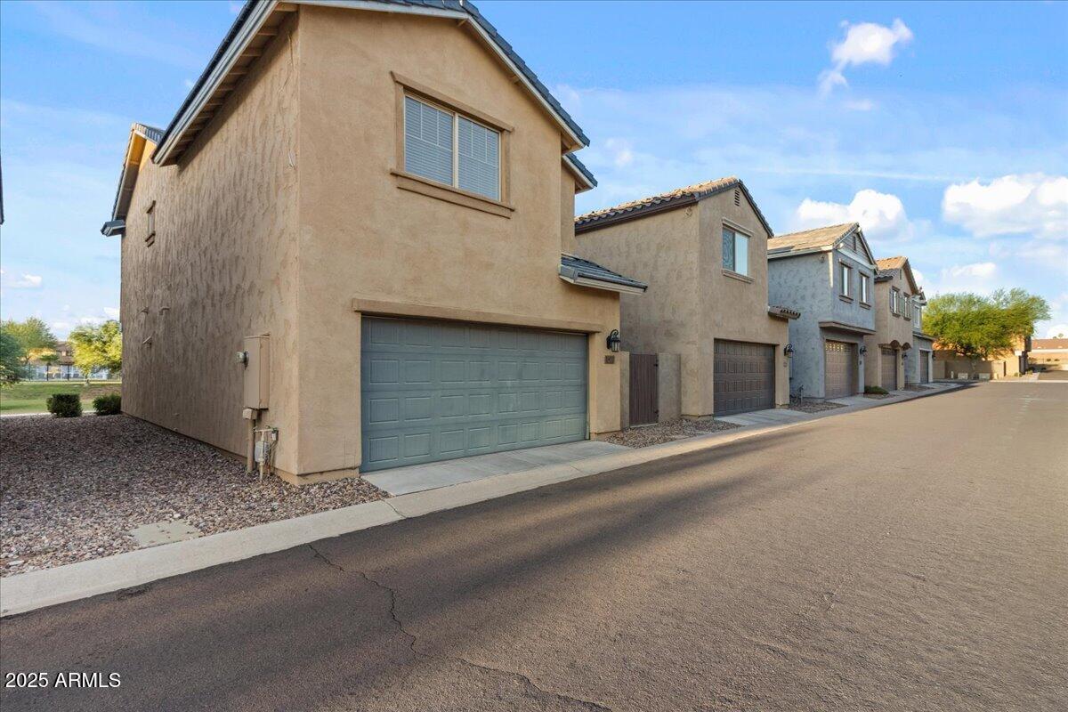 11452 West St John Road Surprise, AZ 85378 - Photo 25 of 29 a view of a house with a street