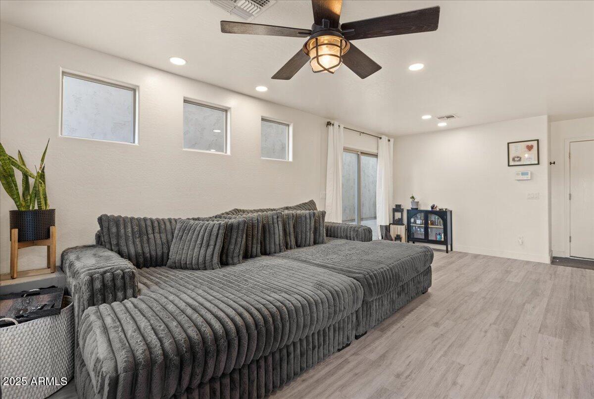 11452 West St John Road Surprise, AZ 85378 - Photo 4 of 29 a bedroom with bed and wooden floor