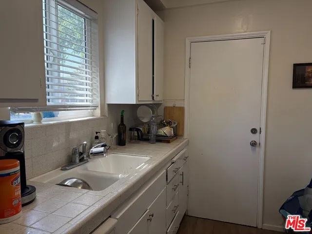 a bathroom with a sink and a window