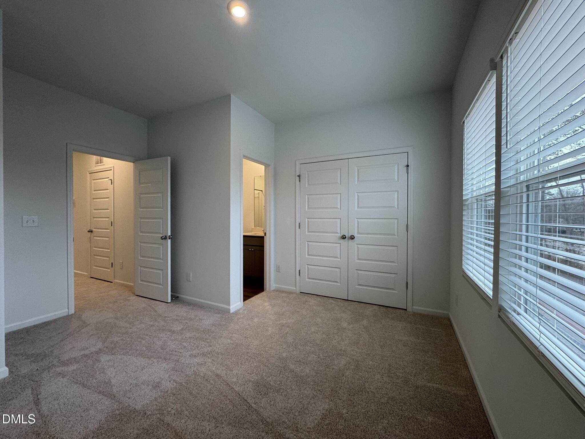 3312 Bomore Road Raleigh, NC 27610 - Photo 15 of 20 an empty room with windows and closet