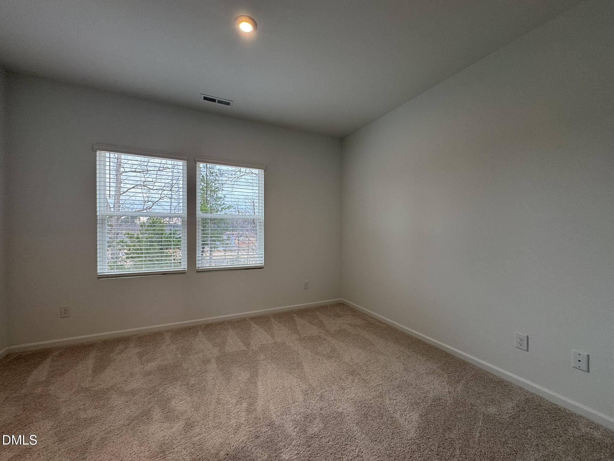 3312 Bomore Road Raleigh, NC 27610 - Photo 16 of 20 an empty room with windows