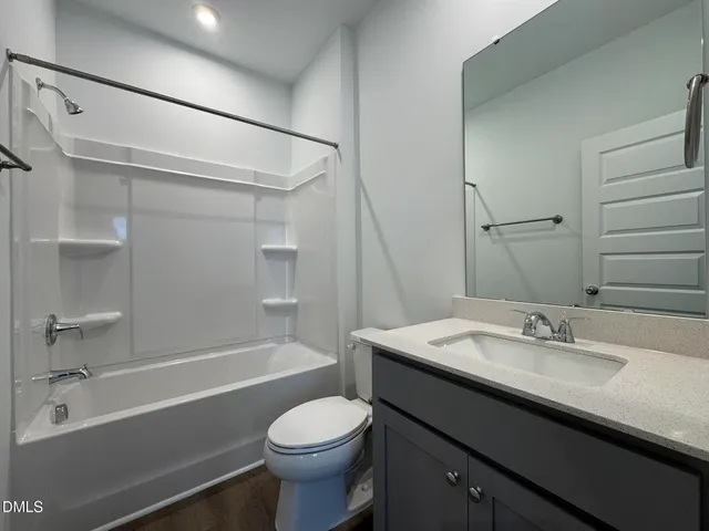 a bathroom with a sink a toilet and a bathtub