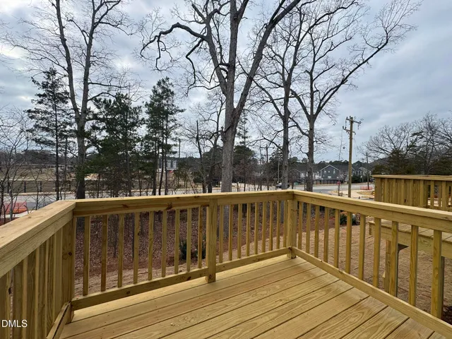 a view of wooden deck with a trees