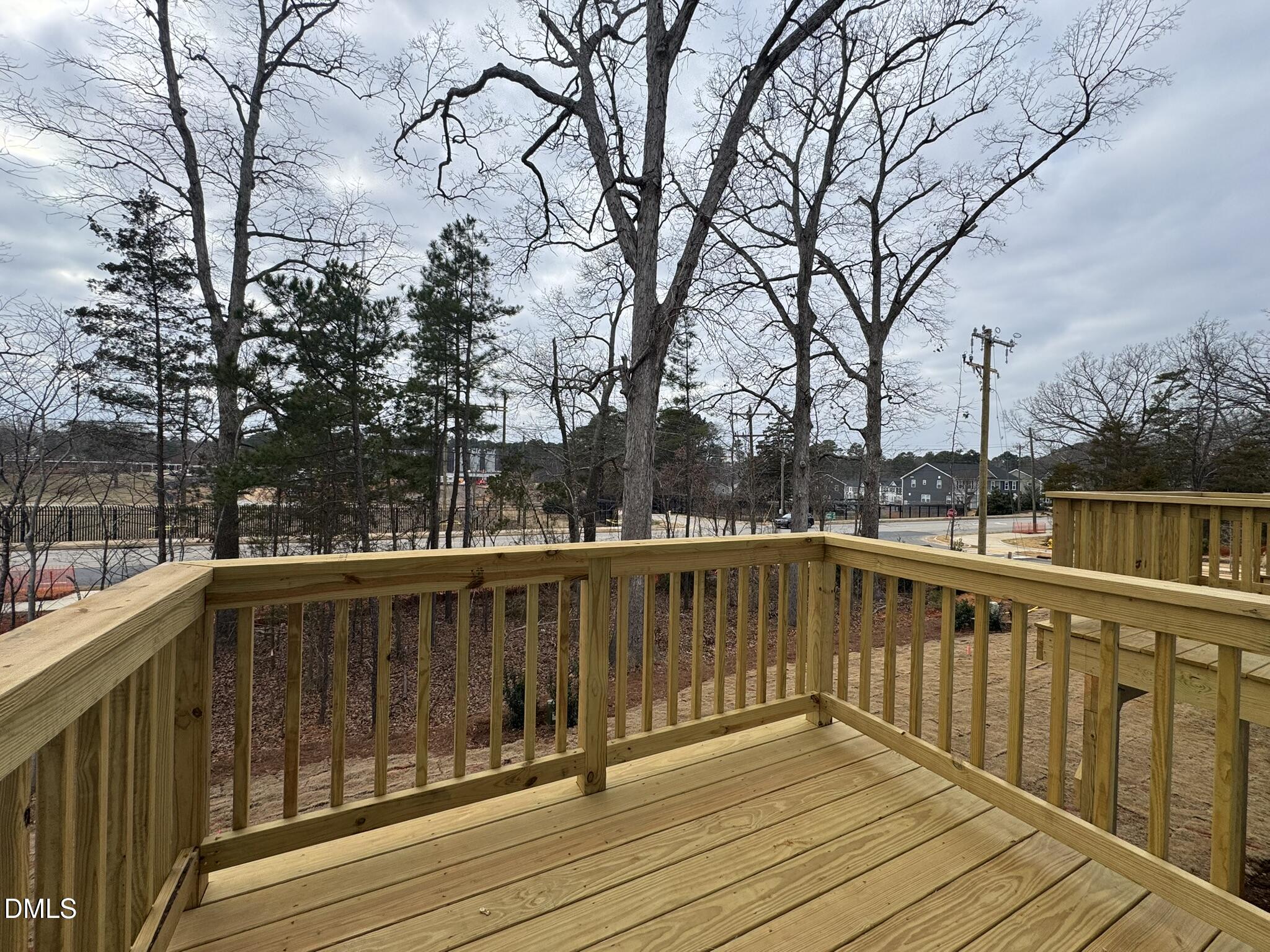 3312 Bomore Road Raleigh, NC 27610 - Photo 7 of 20 a view of wooden deck with a trees