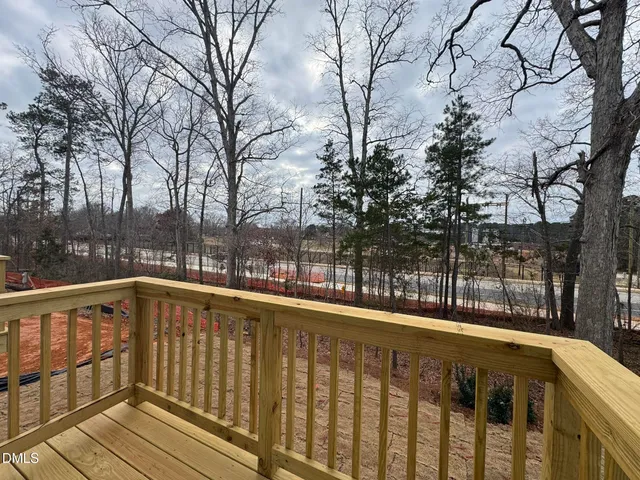 a view of a balcony with tree