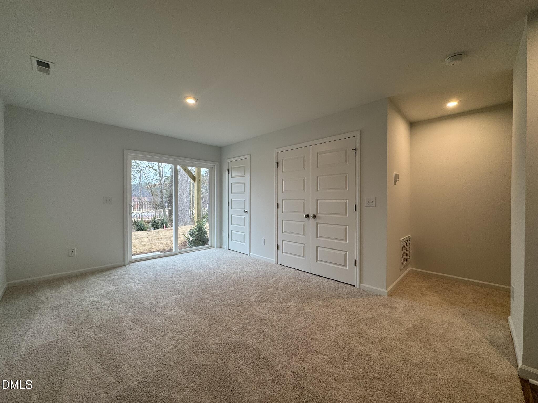 3312 Bomore Road Raleigh, NC 27610 - Photo 9 of 20 a view of an empty room with a window