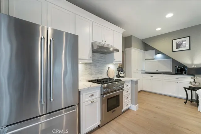 a view of living room with furniture and a chandelier