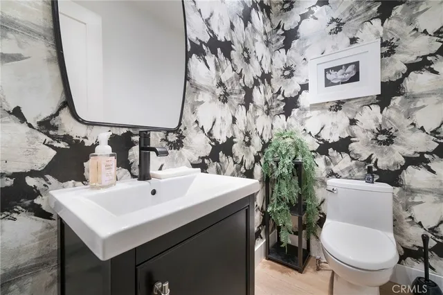 a bed room with a bed and a chandelier