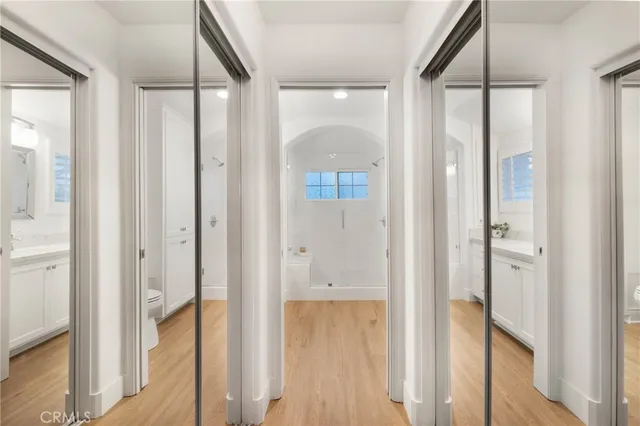 a bedroom with a bed and ceiling fan