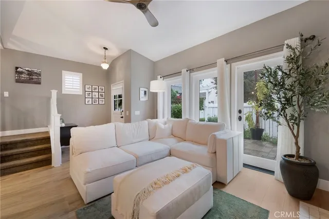 a kitchen with stainless steel appliances kitchen island granite countertop a table chairs and a refrigerator