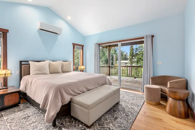 a bedroom with a bed and glass window