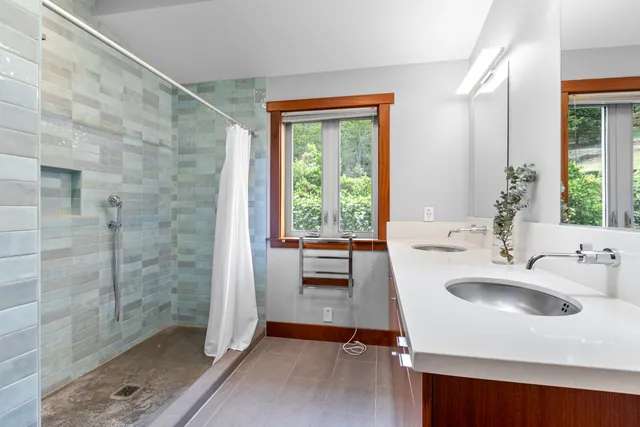 a bathroom with a sink and a large mirror