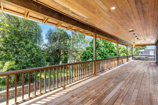 a view of balcony with wooden floor