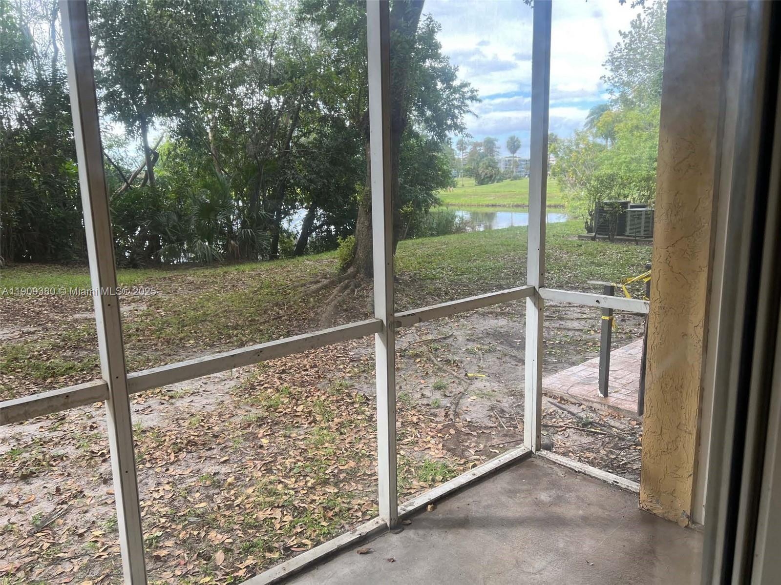 4055 West McNab Road, Unit H103 Pompano Beach, FL 33069 - Photo 13 of 14 a view of outdoor space with backyard