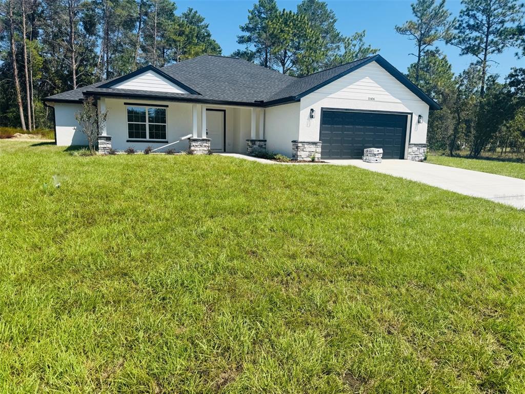 a front view of a house with yard