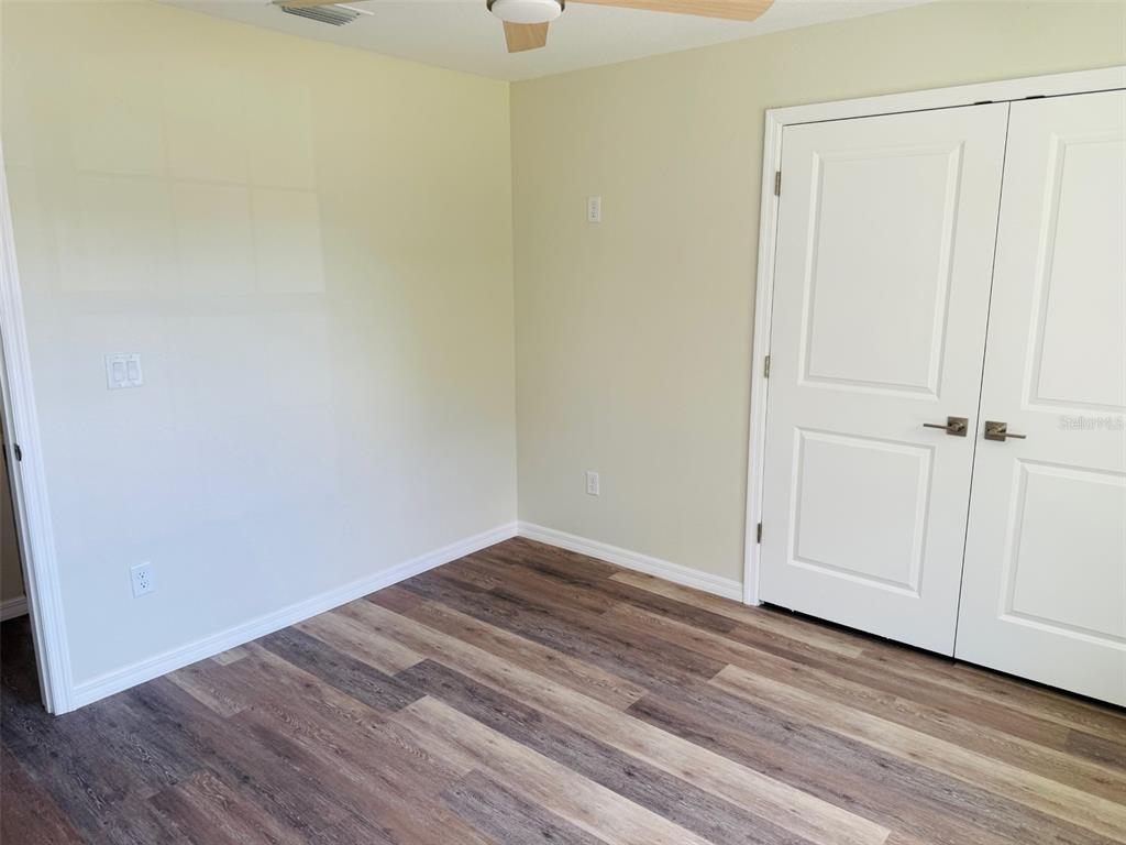 13465 Canyon Swallow Road Weeki Wachee, FL 34614 - Photo 16 of 22 a view of a small space with wooden floor