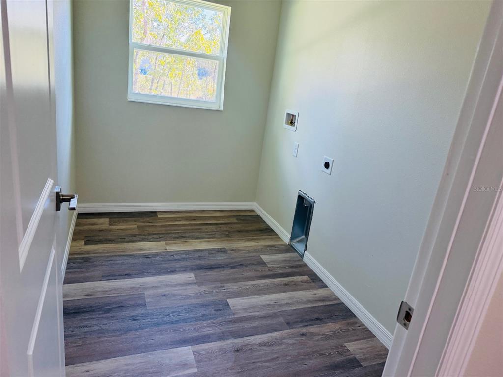 13465 Canyon Swallow Road Weeki Wachee, FL 34614 - Photo 17 of 22 a view of wooden floor