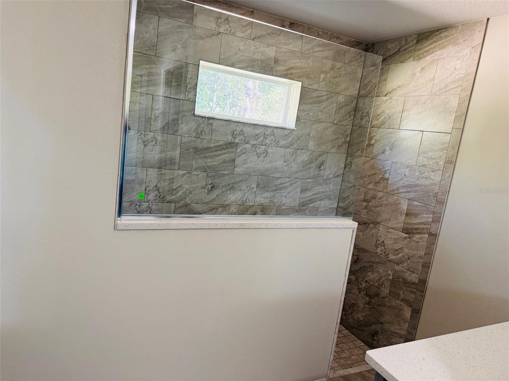 13465 Canyon Swallow Road Weeki Wachee, FL 34614 - Photo 18 of 22 a bathroom with a sink and toilet