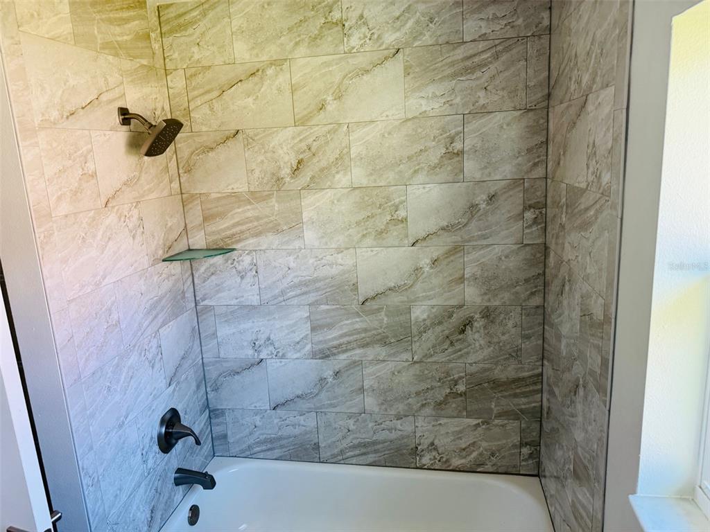13465 Canyon Swallow Road Weeki Wachee, FL 34614 - Photo 22 of 22 a bathroom with a bathtub