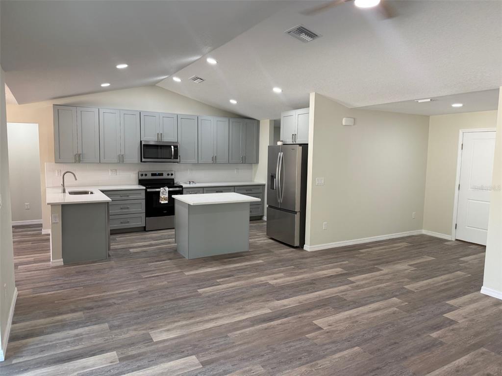 13465 Canyon Swallow Road Weeki Wachee, FL 34614 - Photo 5 of 22 a view of kitchen with wooden floor