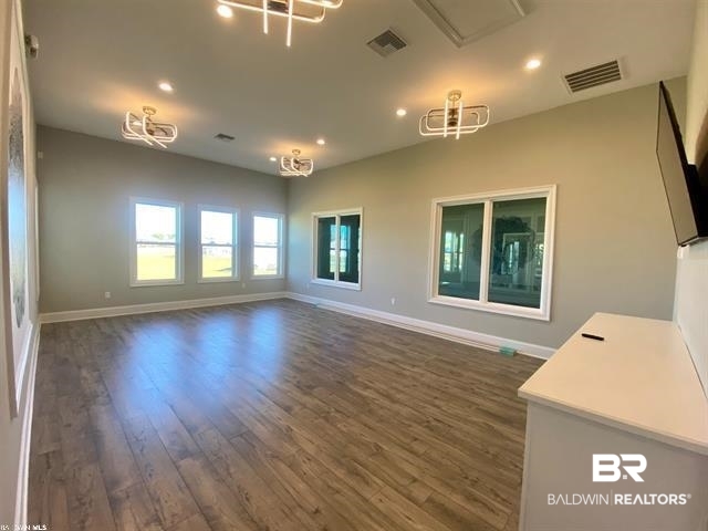 11202 Animal Kingdom Way Daphne, AL 36526 - Photo 13 of 31 Unfurnished living room featuring dark hardwood / wood-style floors
