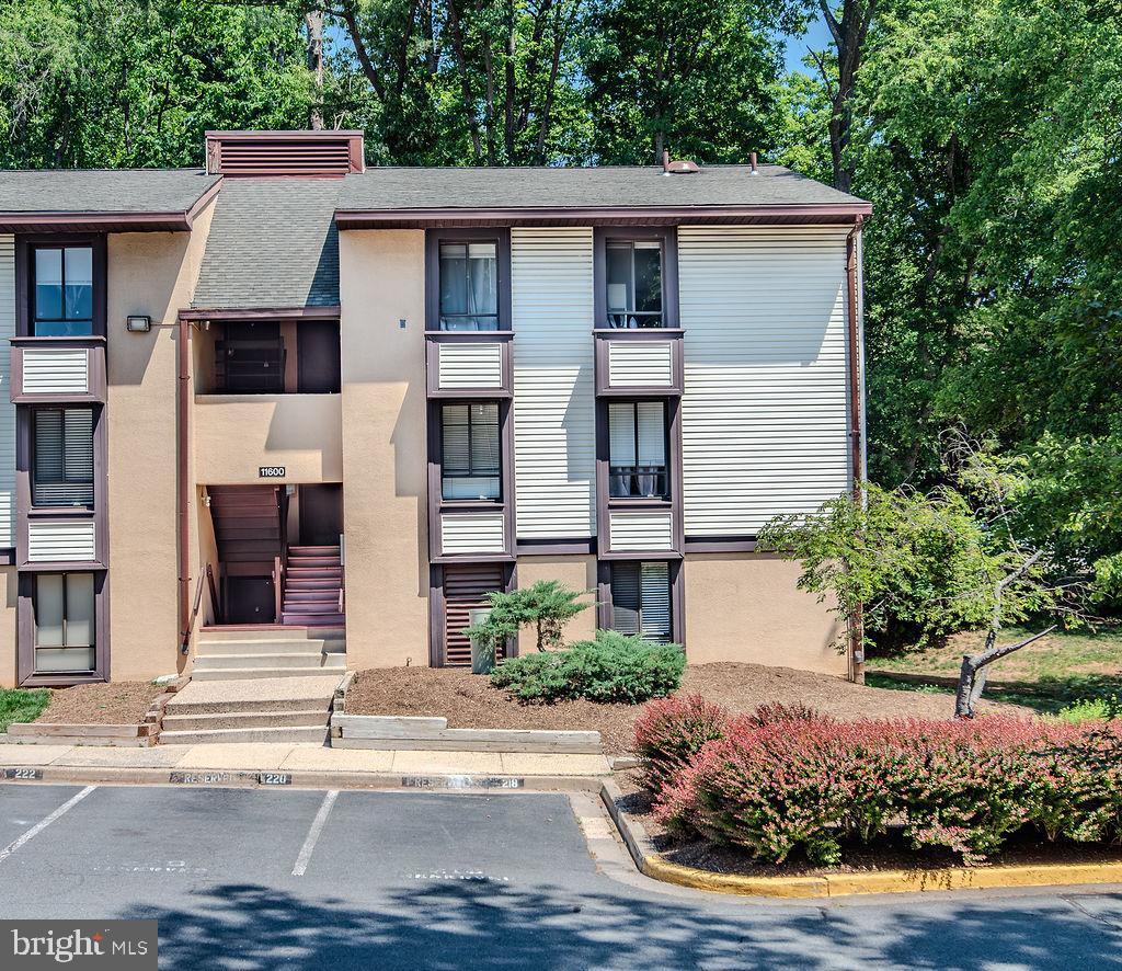 11600 Stoneview Square, Unit 60/2B Reston, VA 20191 - Photo 26 of 27 a front view of a house with a yard