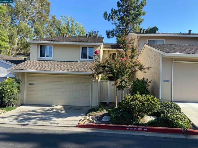 a house with trees in the background