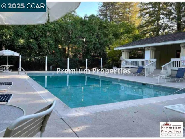 a view of a house with backyard porch and sitting area
