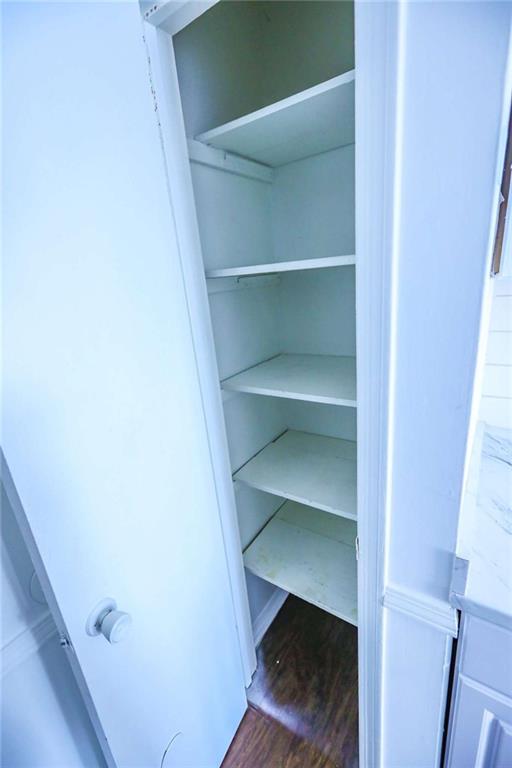1967 Singer Way Lithonia, GA 30058 - Photo 18 of 27 a view of walk in closet with empty racks