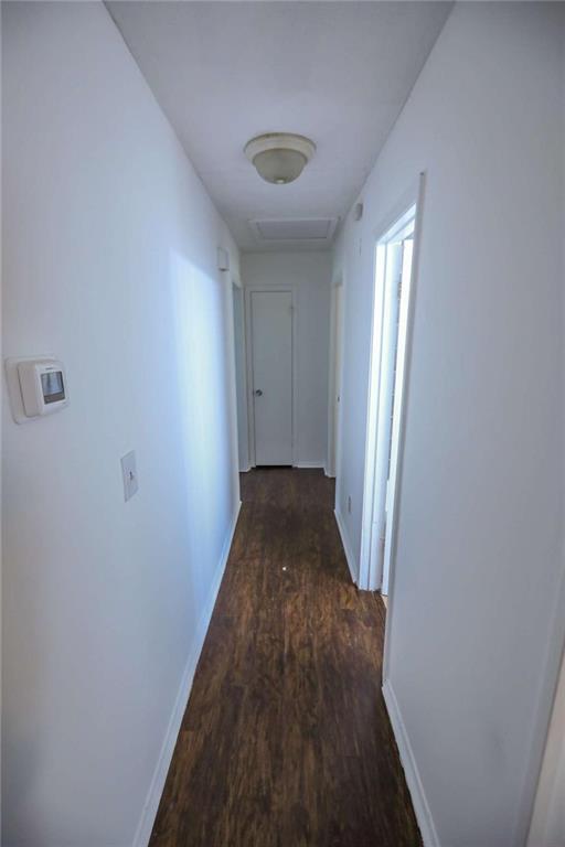 1967 Singer Way Lithonia, GA 30058 - Photo 24 of 27 a view of a hallway with wooden floor and staircase
