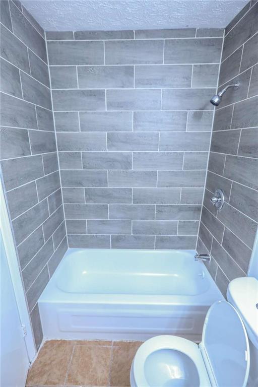 1967 Singer Way Lithonia, GA 30058 - Photo 8 of 27 a bathroom with a shower and a bathtub