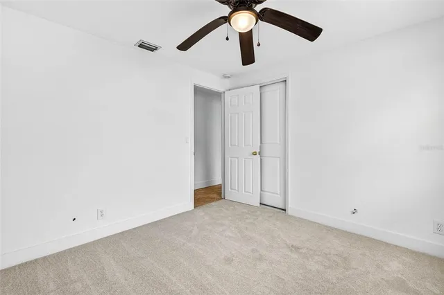 a view of an empty room with a bathroom