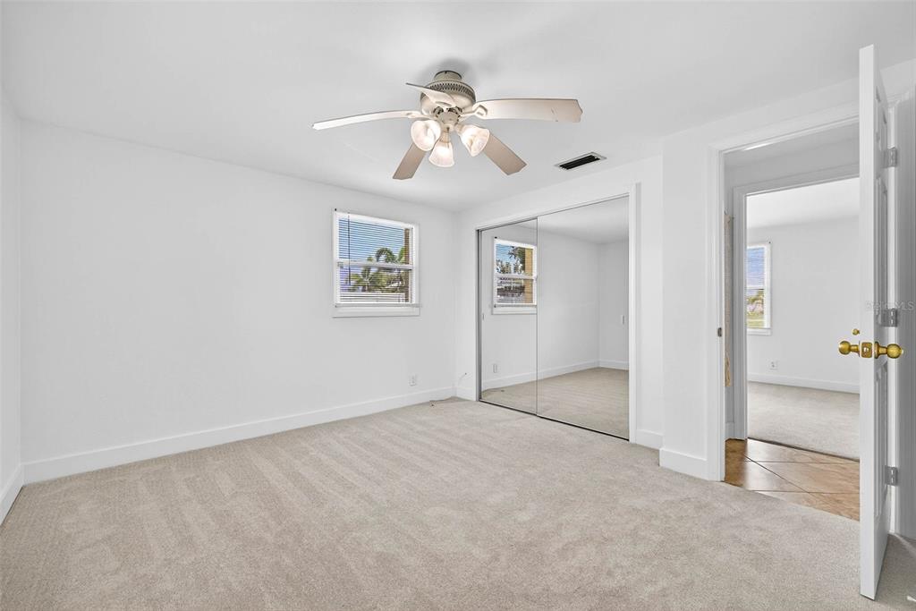 3225 West Shell Point Road Ruskin, FL 33570 - Photo 26 of 57 an empty room with fan and windows