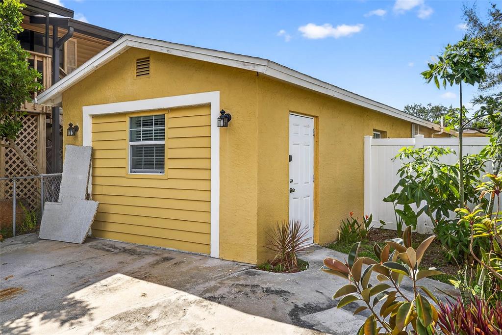 3225 West Shell Point Road Ruskin, FL 33570 - Photo 42 of 57 a front view of a house with garden