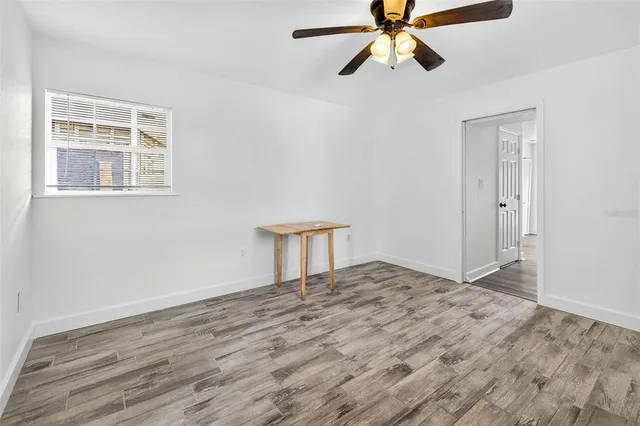 a kitchen with a refrigerator and a stove top oven