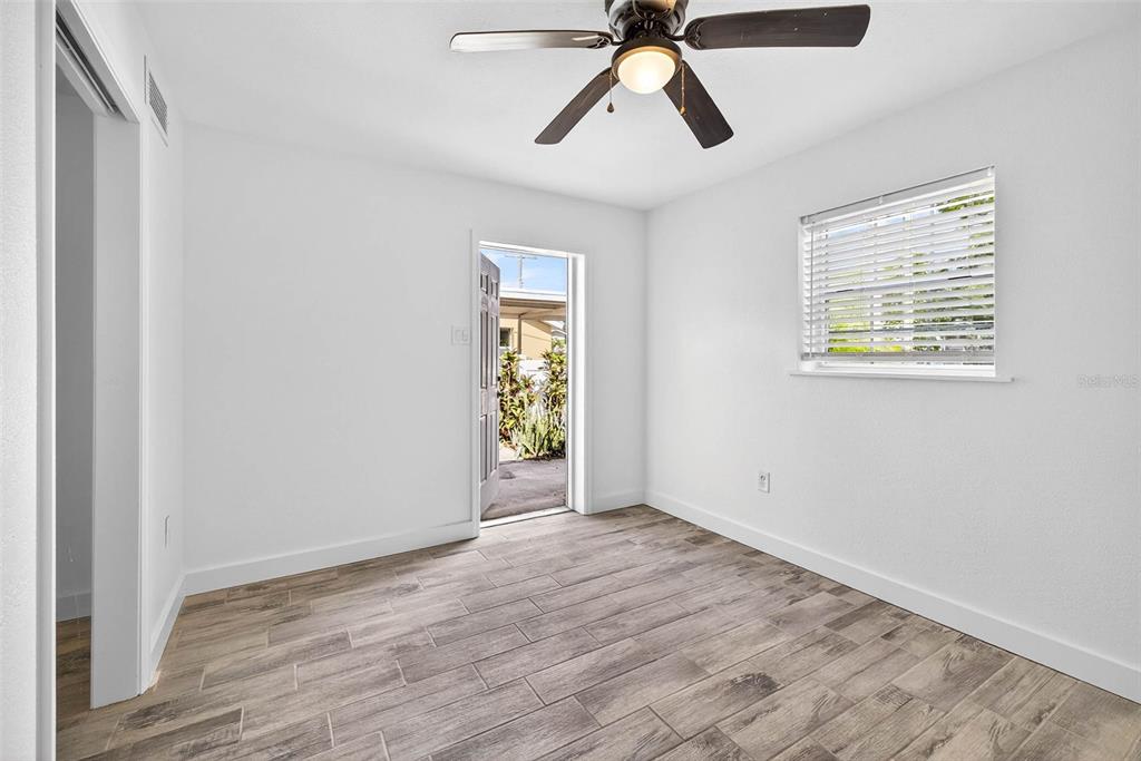 3225 West Shell Point Road Ruskin, FL 33570 - Photo 44 of 57 wooden floor in an empty room with a window