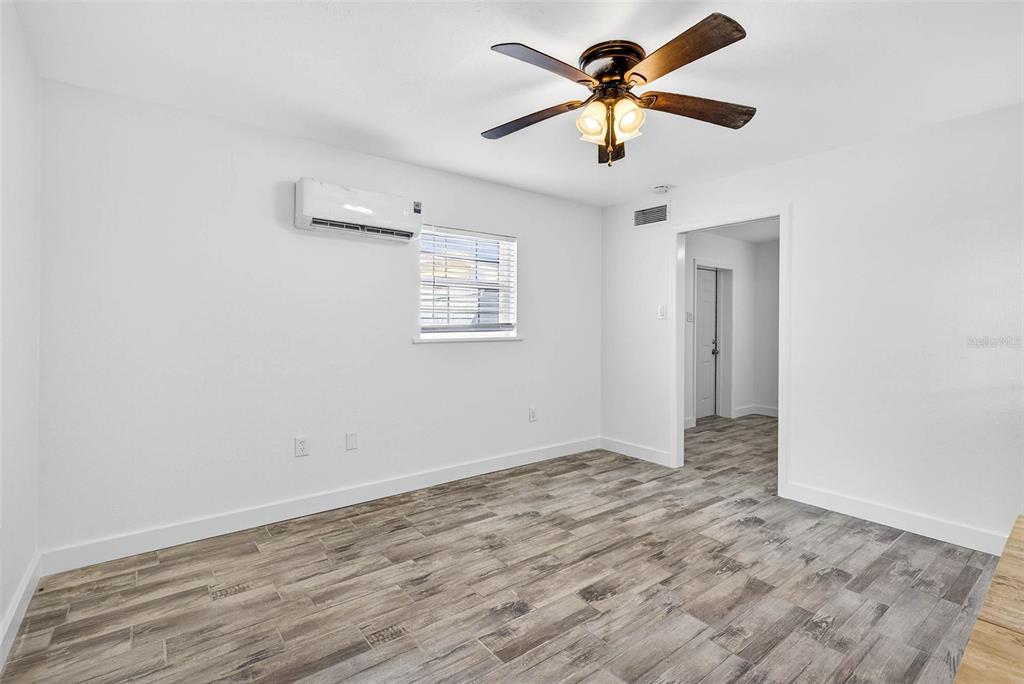 3225 West Shell Point Road Ruskin, FL 33570 - Photo 45 of 57 an empty room with a window and a fan