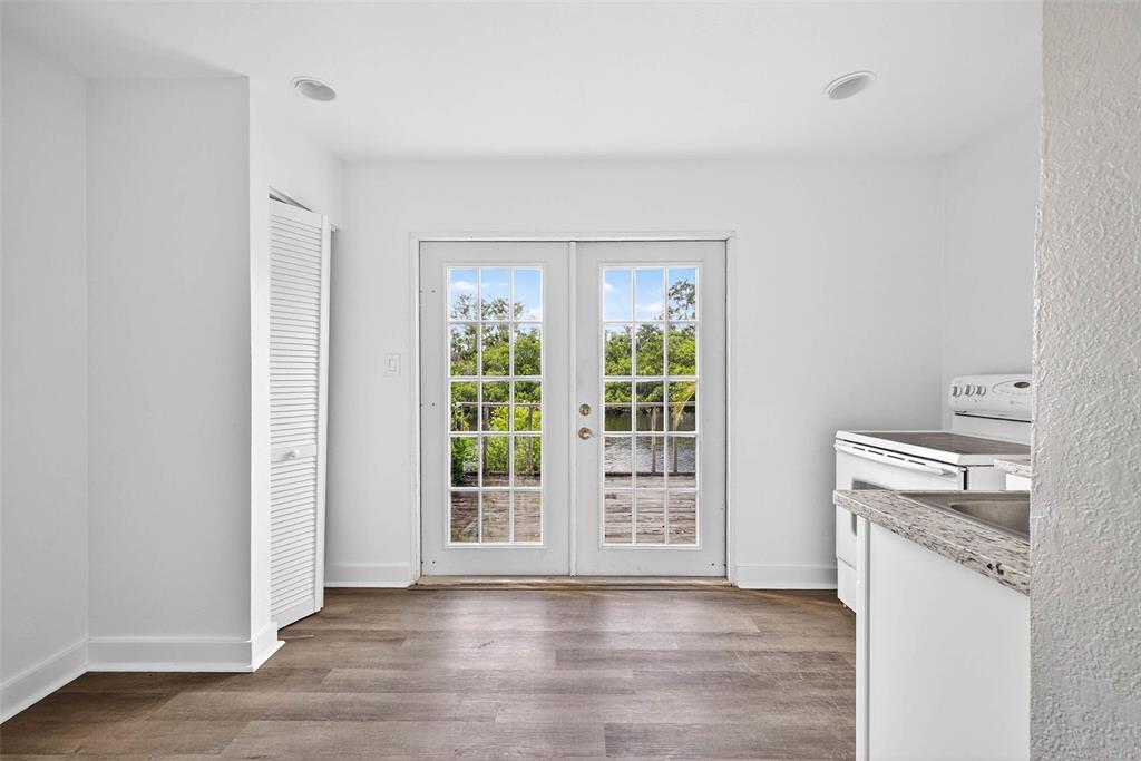 3225 West Shell Point Road Ruskin, FL 33570 - Photo 47 of 57 wooden floor in an empty room with a window