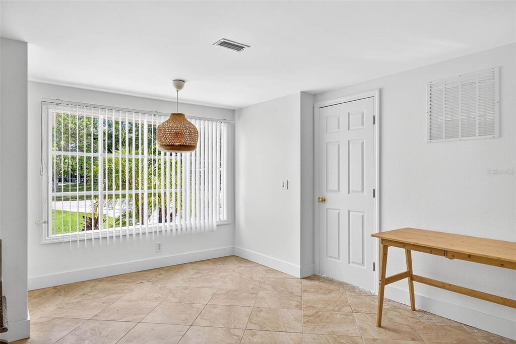 3225 West Shell Point Road Ruskin, FL 33570 - Photo 9 of 57 a view of an empty room with a window