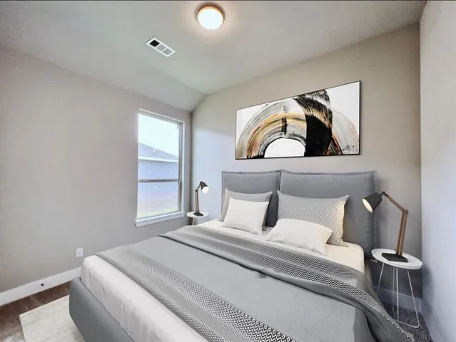 a bedroom with a bed and window