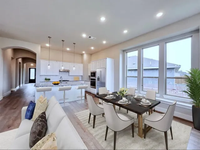 a view of a dining room with furniture window and outside view